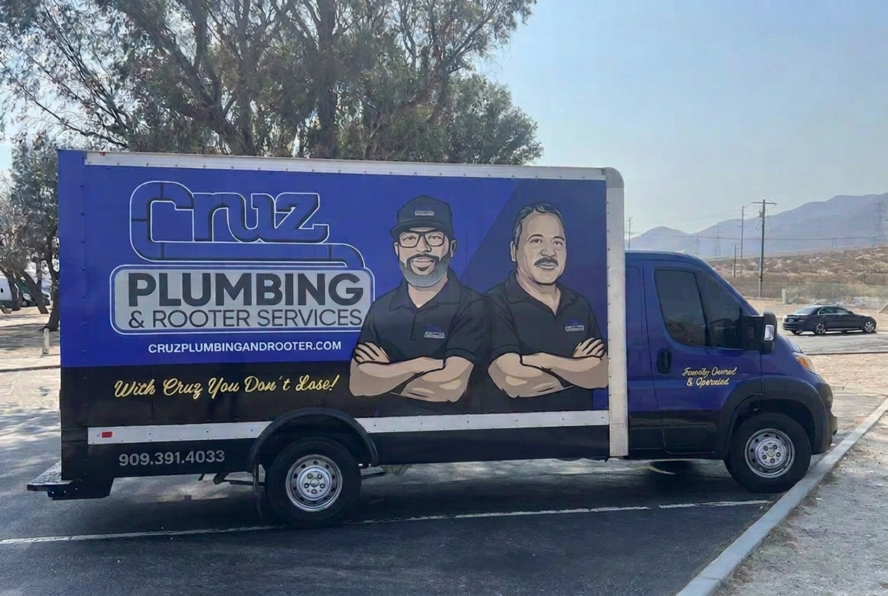 Blue Cruz Plumbing service truck with owner cartoons and company branding