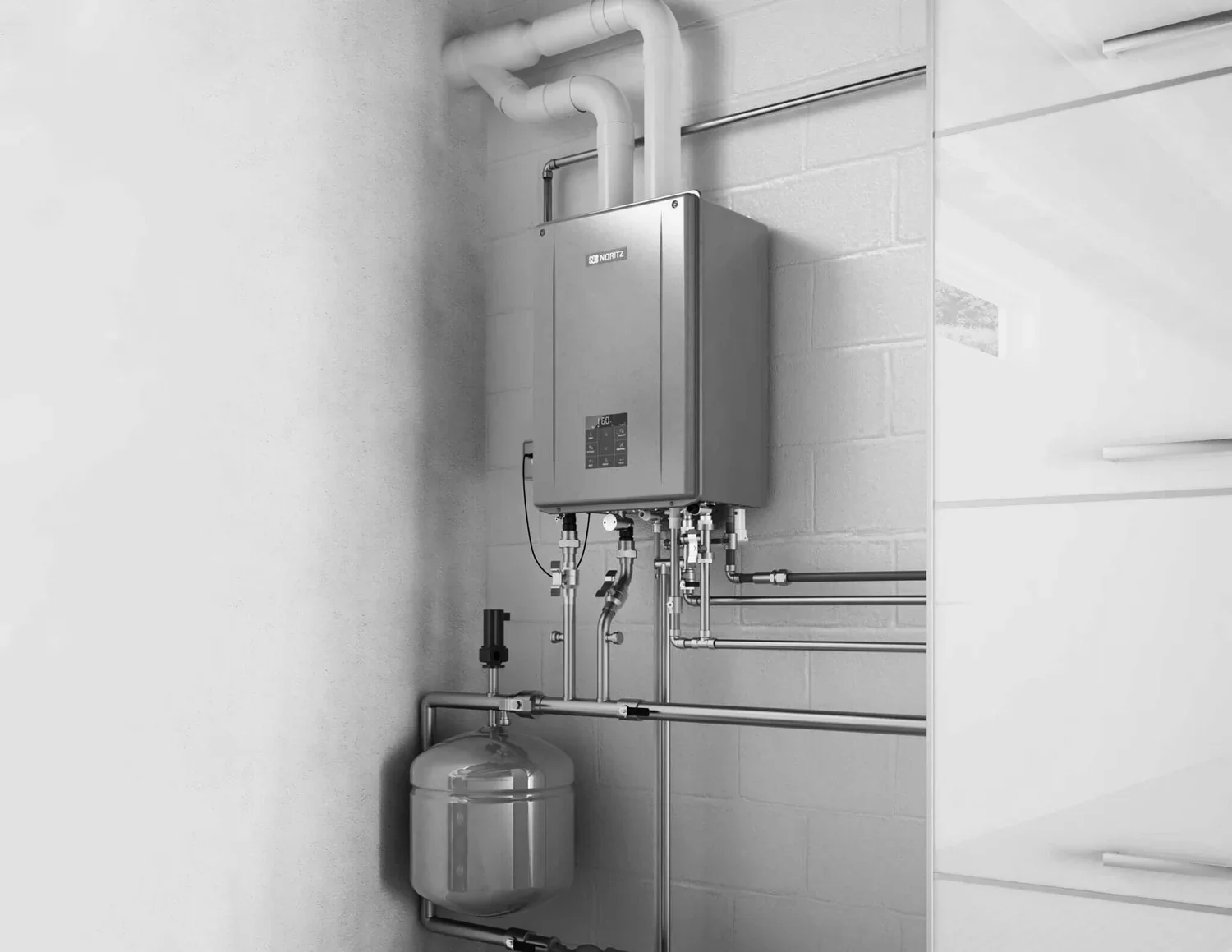 Wall-mounted tankless water heater with connected plumbing